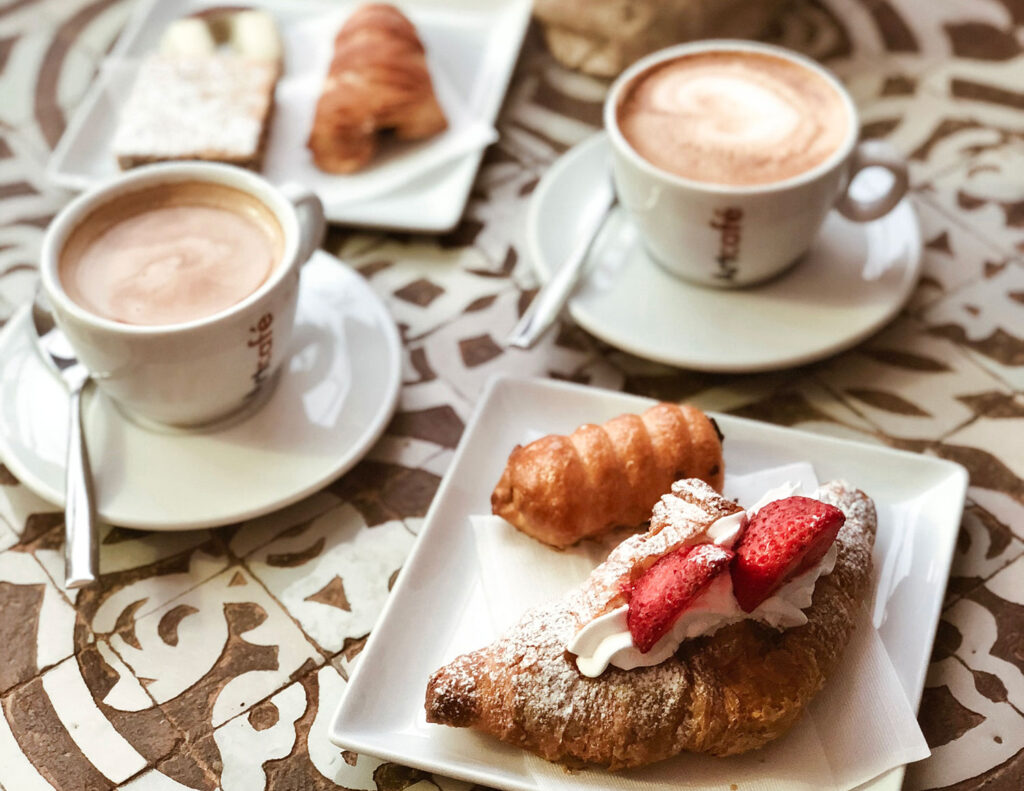Cappuccino and a croissant for Italian breakfast.