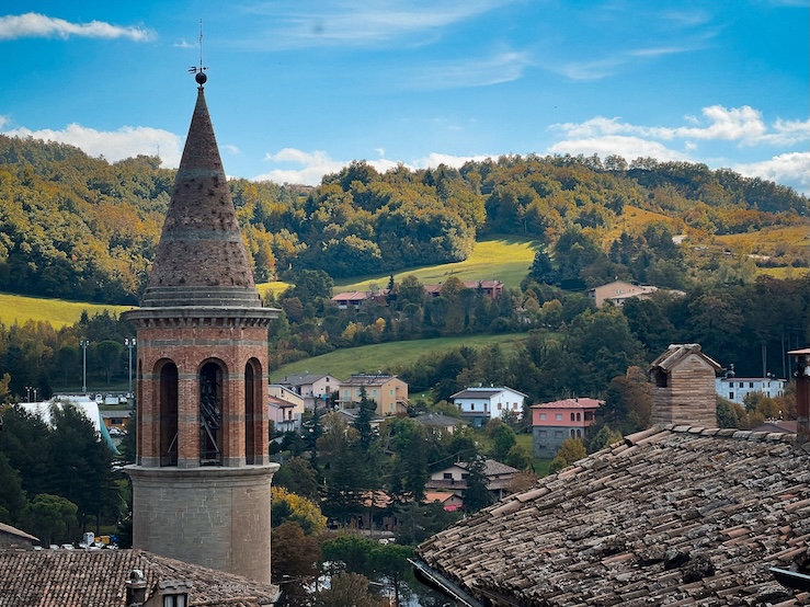 Rooftops of Sant’Agata Feltria with bell tower and Marecchia Valley view.