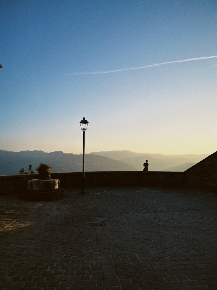 Roncofreddo evening view with hillside backdrop.