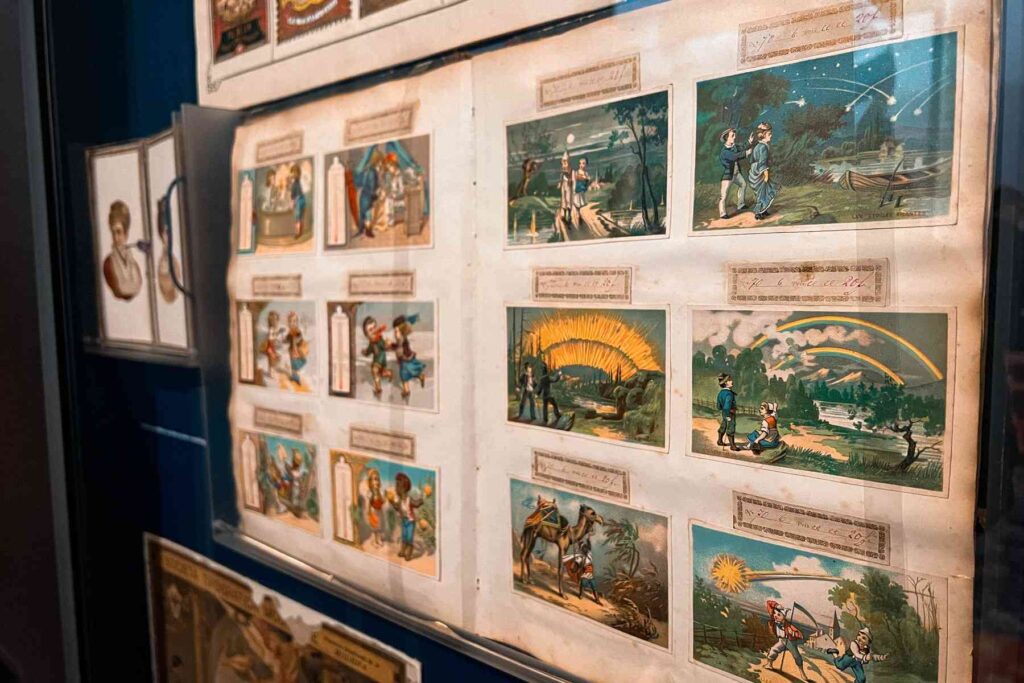 Vintage illustrated prints on display in a Modena museum