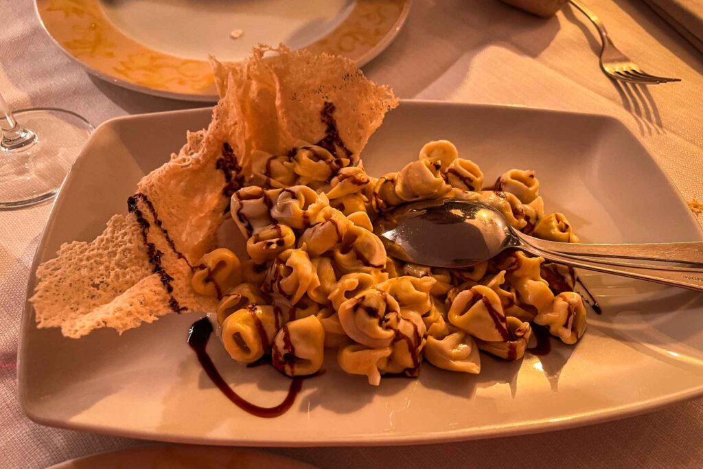 Tortellini in Modena with balsamic vinegar and parmesan crisp