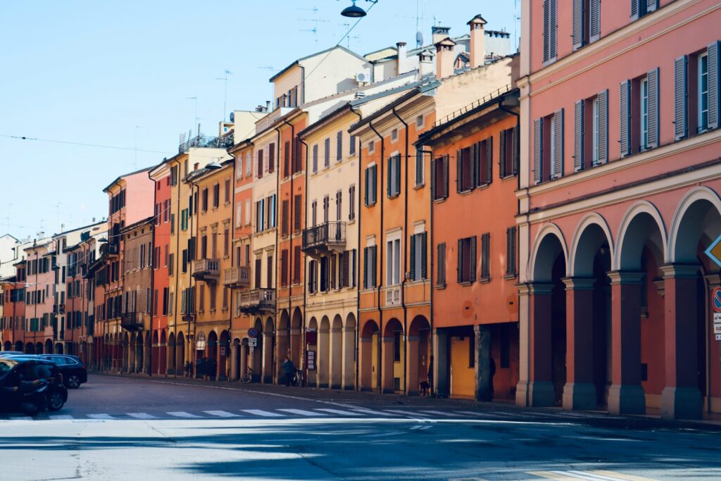 Colorful porticoed buildings in Bologna for practical tips before arriving in Emilia-Romagna