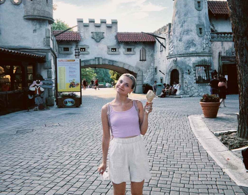 Woman enjoying an Italian theme park or activity village