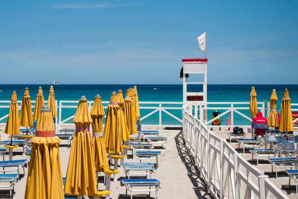 Adriatic beach umbrellas and lounge chairs for choosing the best time to visit Emilia-Romagna