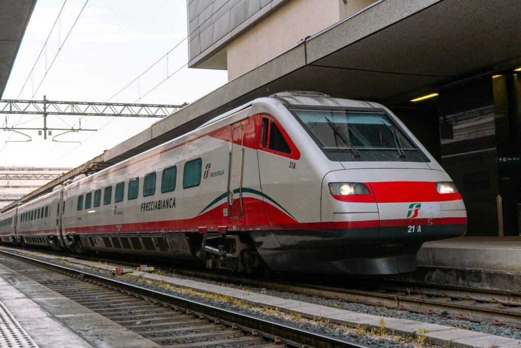 Frecciabianca train at an Italian station for traveling around Emilia-Romagna by rail
